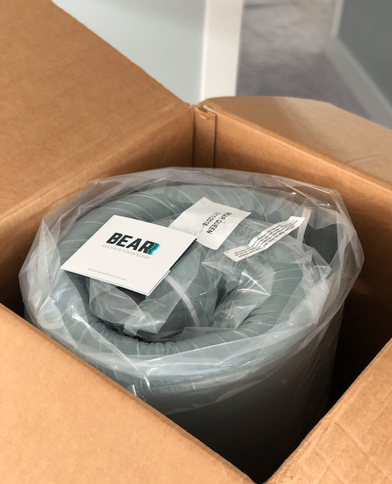 Unboxing the rolled-up mattress