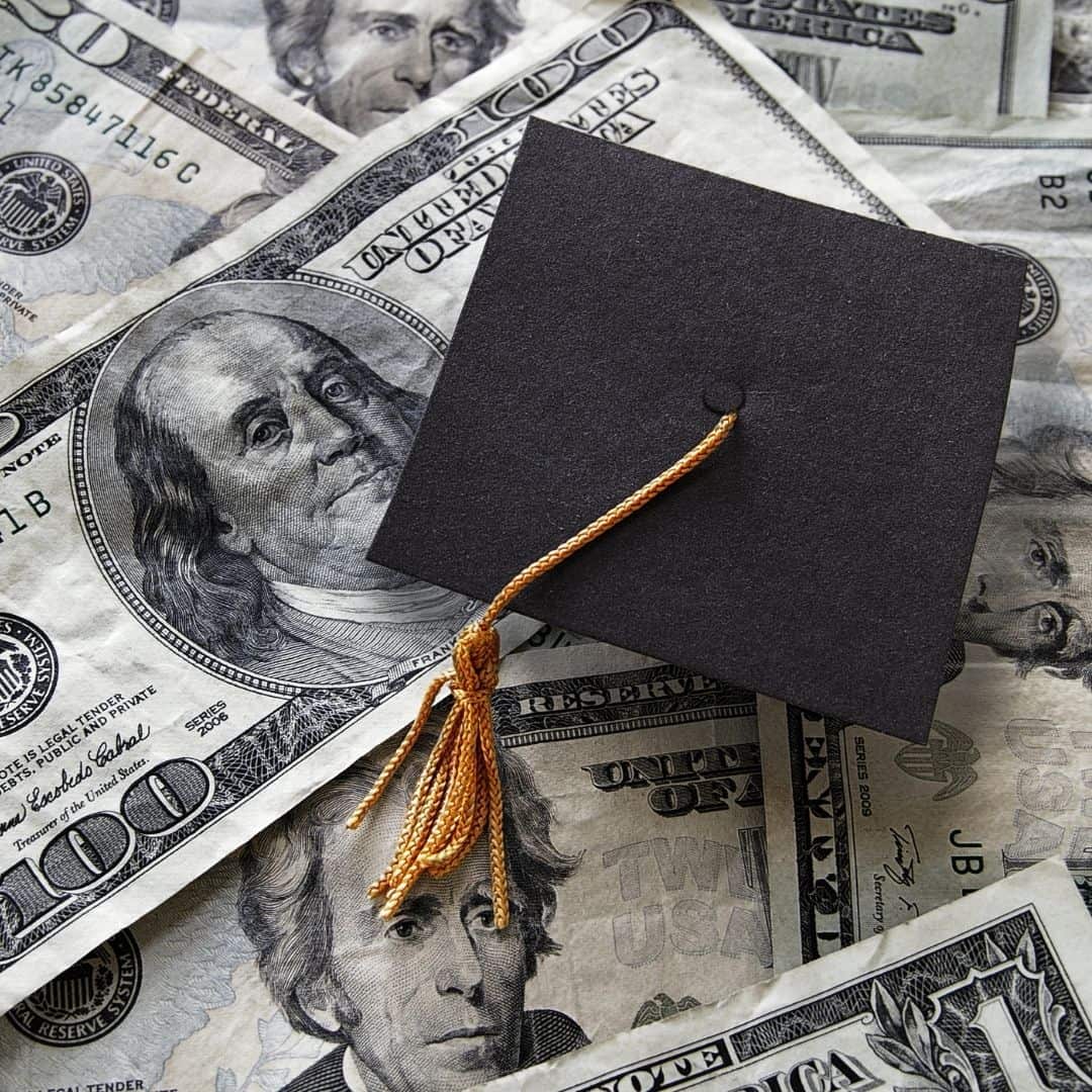 graduation cap and money