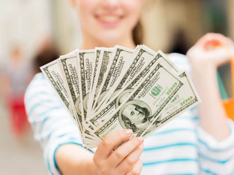 woman holding money