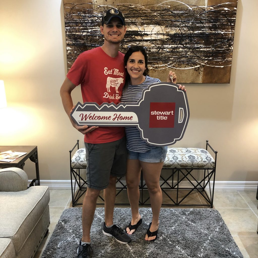 Couple with moving sign: Cheapest way to move out of state
