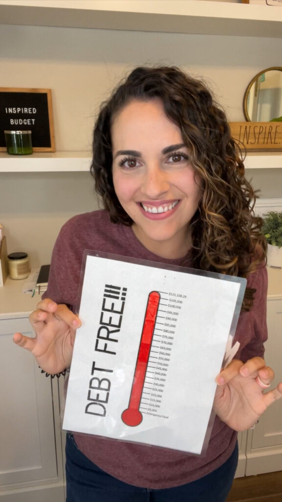 Woman holding a debt free sign